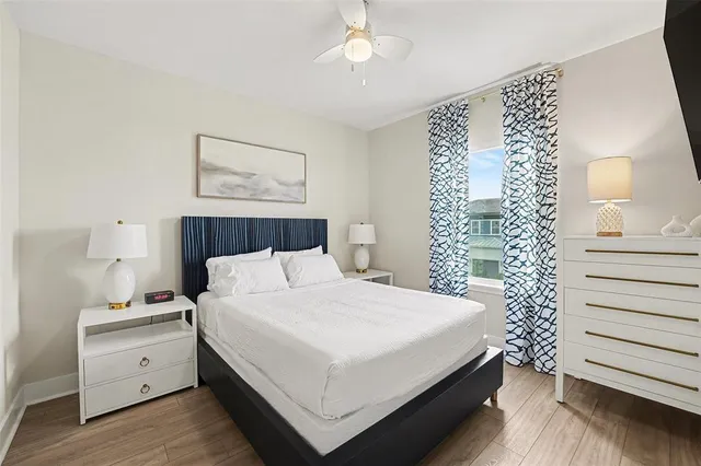 a bedroom with a bed and a night stand