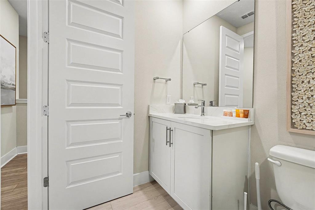 7841 Spectrum Drive Reunion, FL 34747 - Photo 21 of 30 a bathroom with a sink a toilet and shower