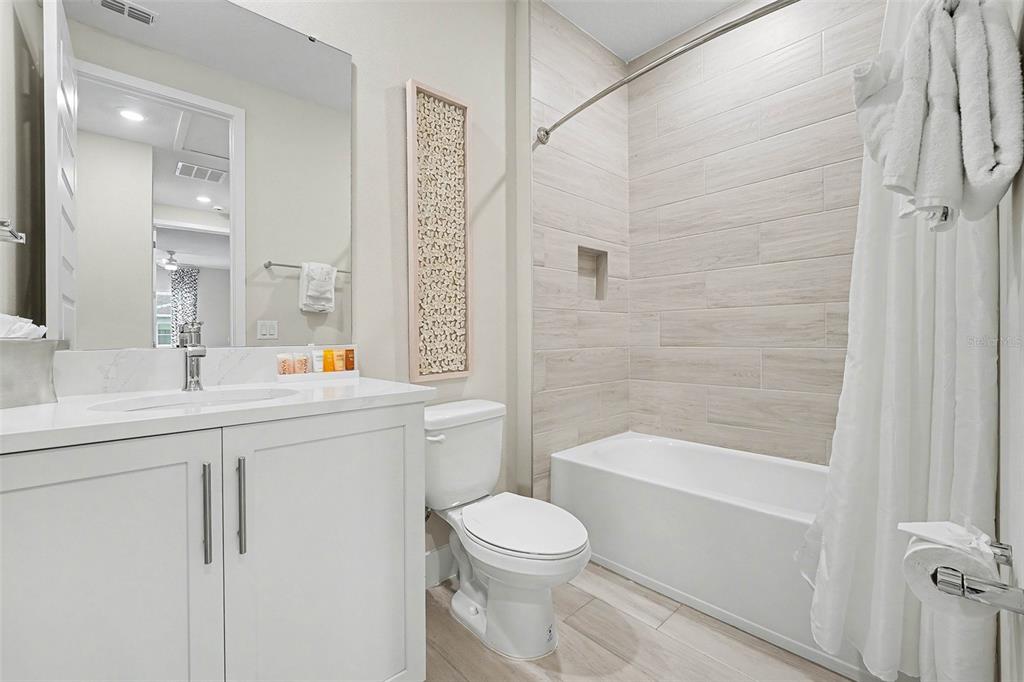 7841 Spectrum Drive Reunion, FL 34747 - Photo 24 of 30 a bathroom with a sink a toilet and shower