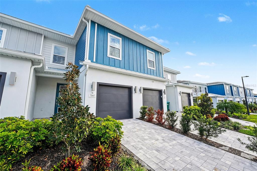 7841 Spectrum Drive Reunion, FL 34747 - Photo 28 of 30 a front view of a house with garden