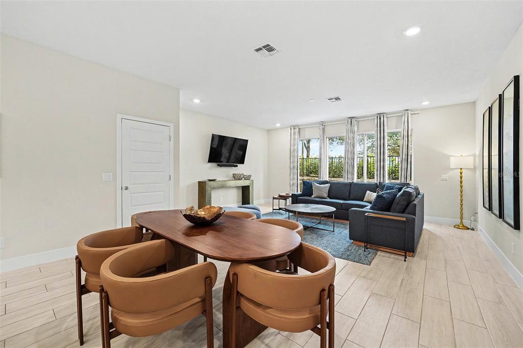 7841 Spectrum Drive Reunion, FL 34747 - Photo 4 of 30 a living room with furniture and a flat screen tv
