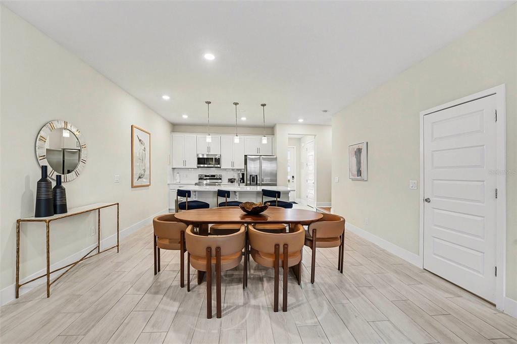 7841 Spectrum Drive Reunion, FL 34747 - Photo 5 of 30 a view of a dining room with furniture and wooden floor