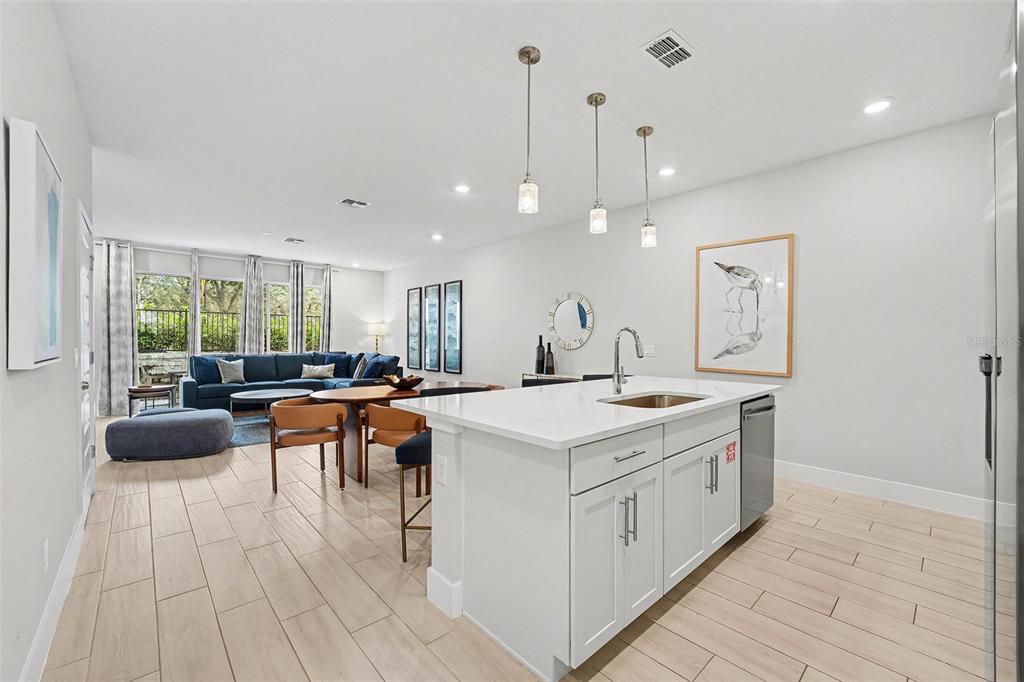 7841 Spectrum Drive Reunion, FL 34747 - Photo 7 of 30 a large white kitchen with a large window