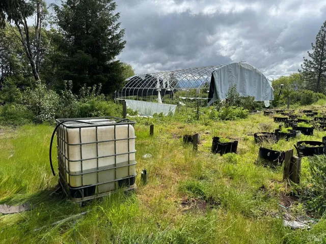 a view of a swimming pool with a yard