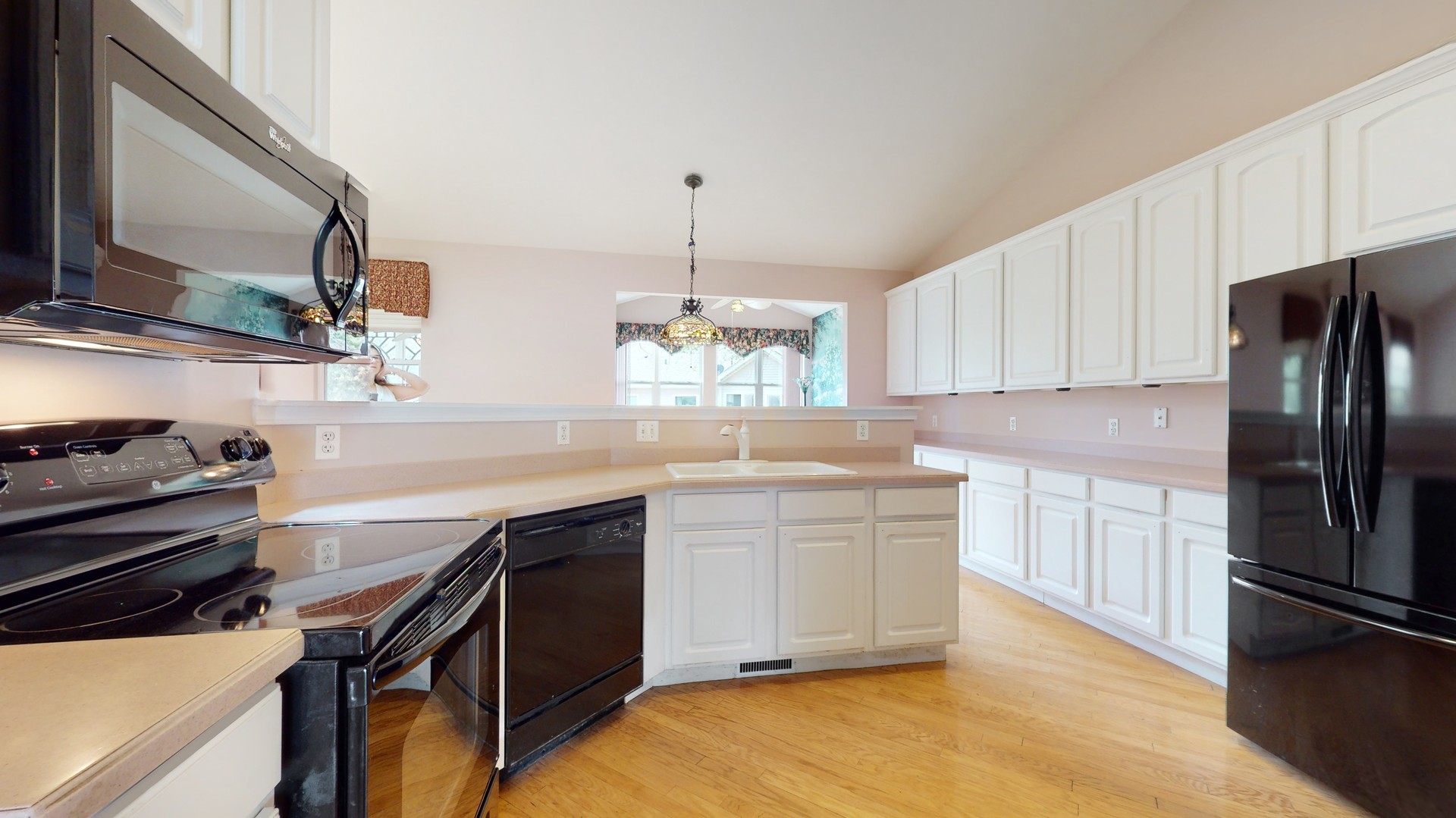 1540 Cadillac Circle Romeoville, IL 60446 - Photo 11 of 32 a kitchen with a sink stainless steel appliances and cabinets