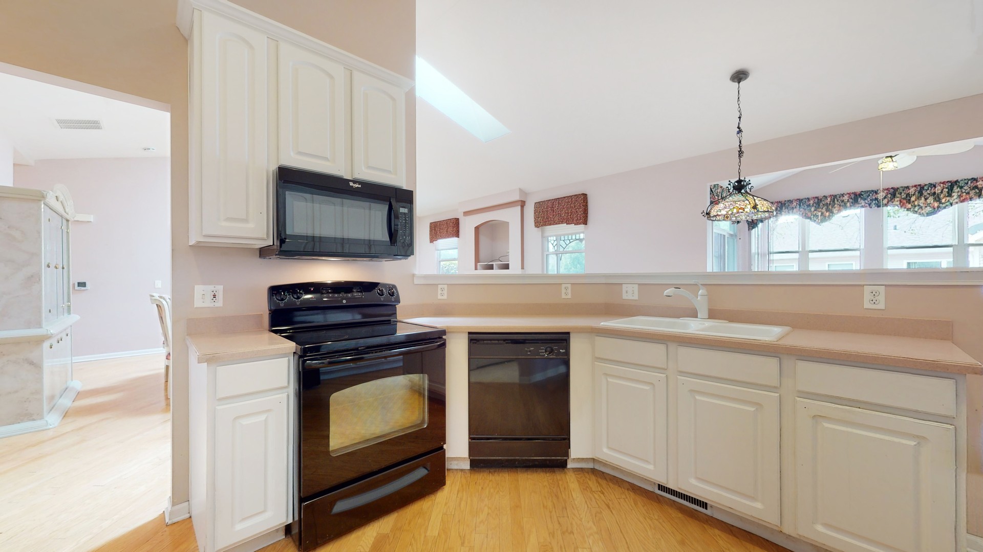 1540 Cadillac Circle Romeoville, IL 60446 - Photo 12 of 32 a kitchen with a sink stove and microwave