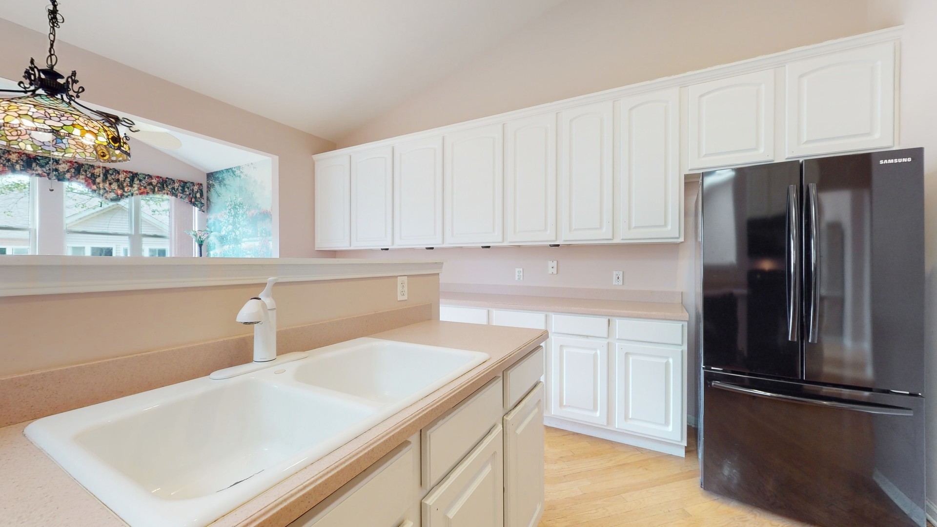 1540 Cadillac Circle Romeoville, IL 60446 - Photo 13 of 32 a kitchen with a refrigerator and a sink