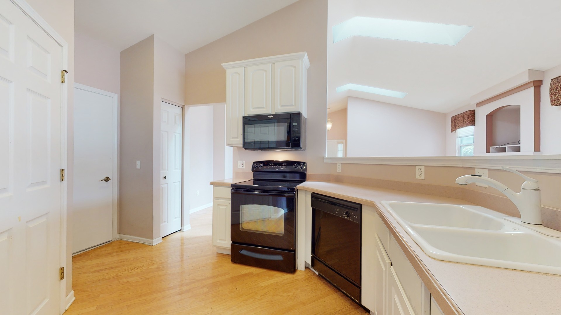 1540 Cadillac Circle Romeoville, IL 60446 - Photo 14 of 32 a kitchen with a sink and a stove top oven