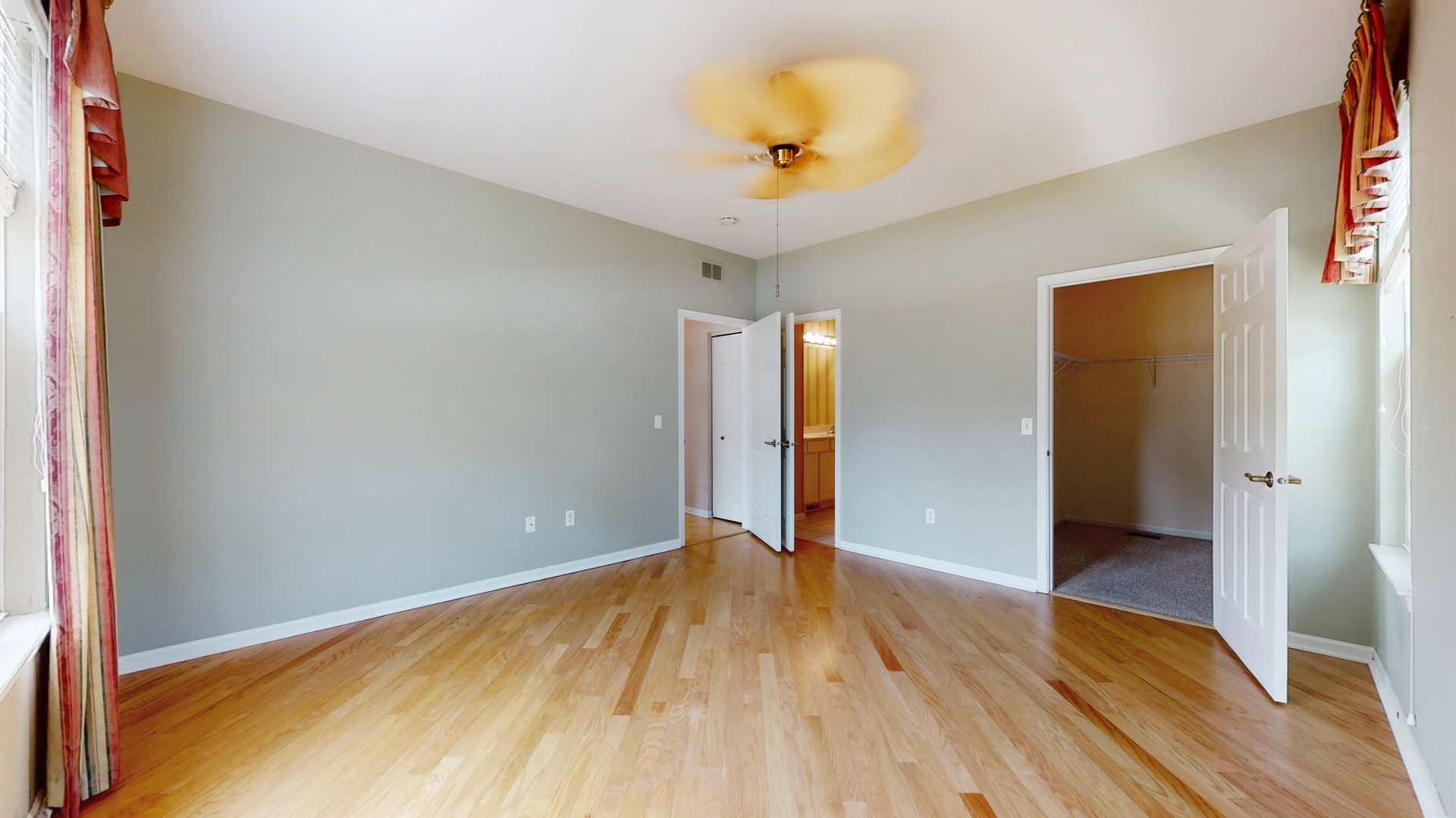 1540 Cadillac Circle Romeoville, IL 60446 - Photo 20 of 32 a view of an empty room with wooden floor and a window