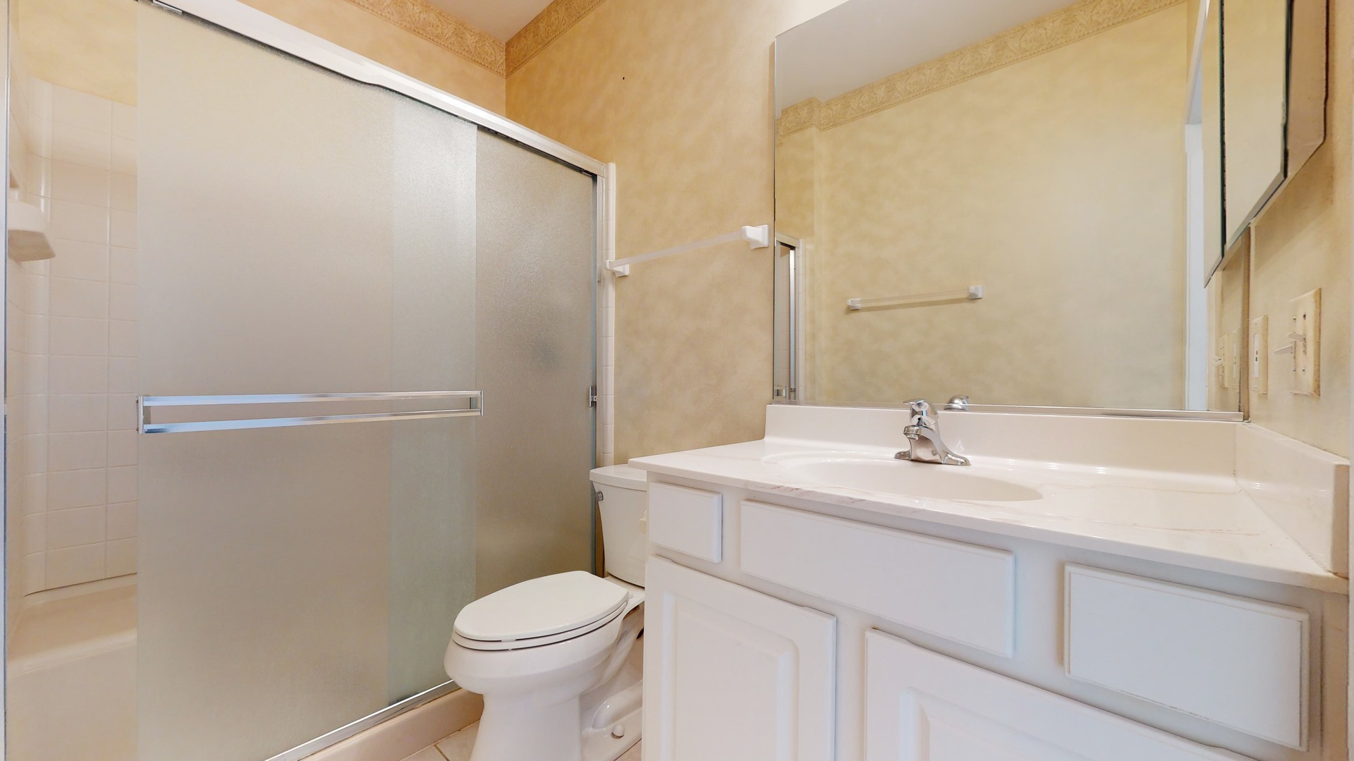 1540 Cadillac Circle Romeoville, IL 60446 - Photo 28 of 32 a bathroom with a sink a toilet and a mirror