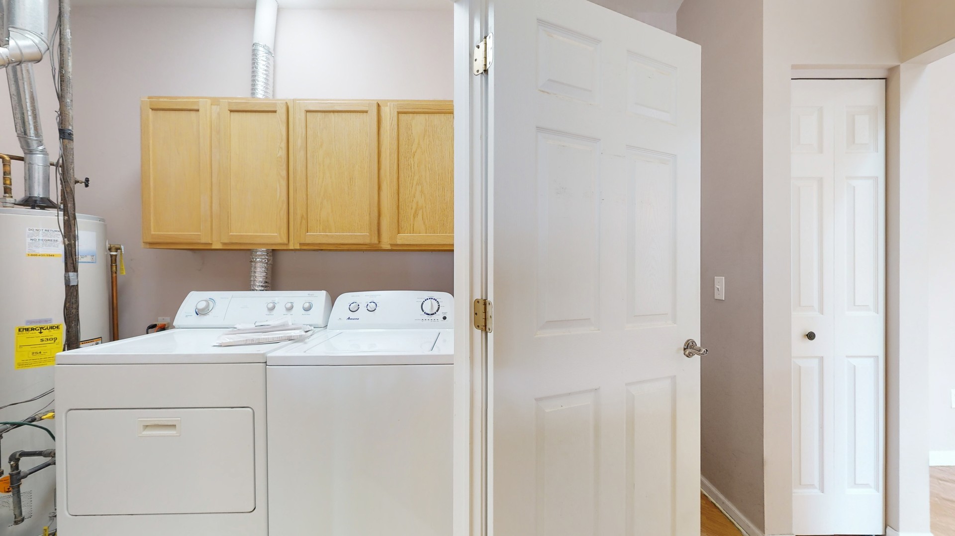 1540 Cadillac Circle Romeoville, IL 60446 - Photo 29 of 32 a utility room with dryer and washer