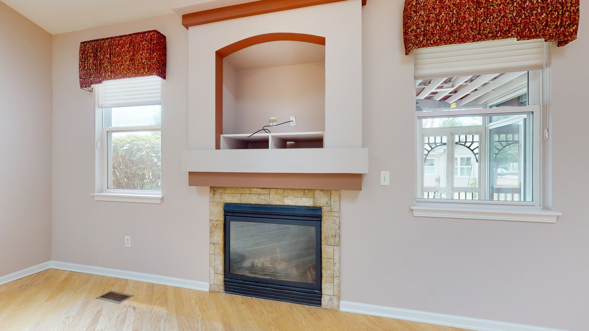 1540 Cadillac Circle Romeoville, IL 60446 - Photo 8 of 32 a living room with a fireplace and a window