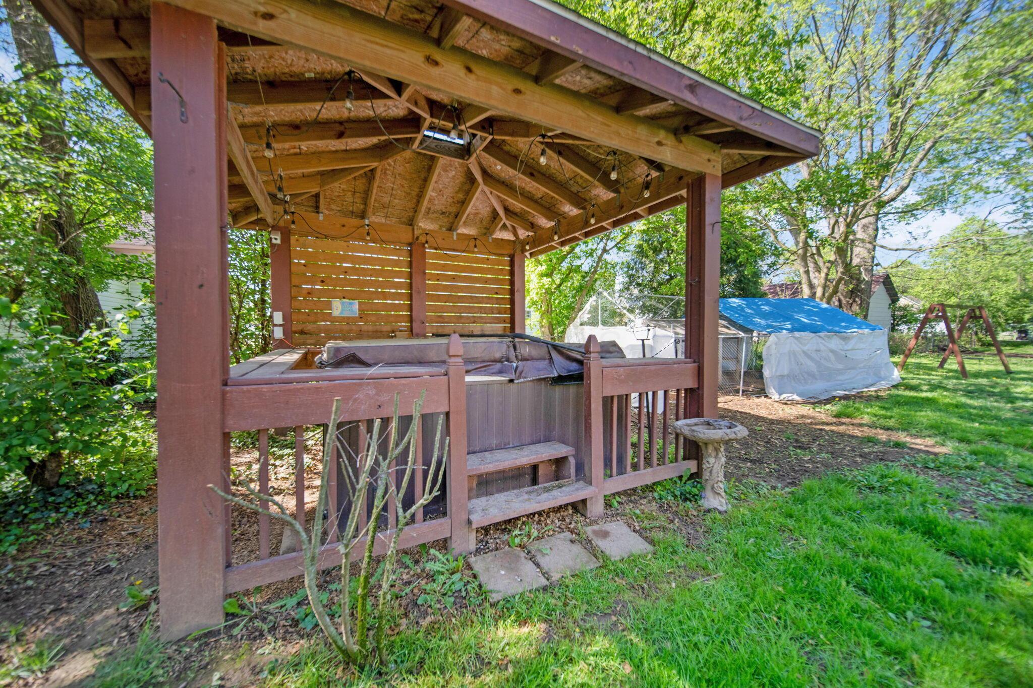 49 Front Street Commercial Point, OH 43116 - Photo 22 of 26 Hot tub with pergola