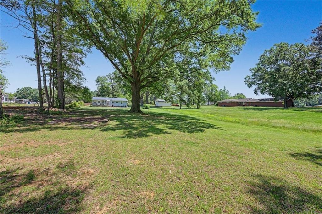 71 North Avery Road Northwest Rome, GA 30165 - Photo 34 of 42 a view of a grassy field with trees