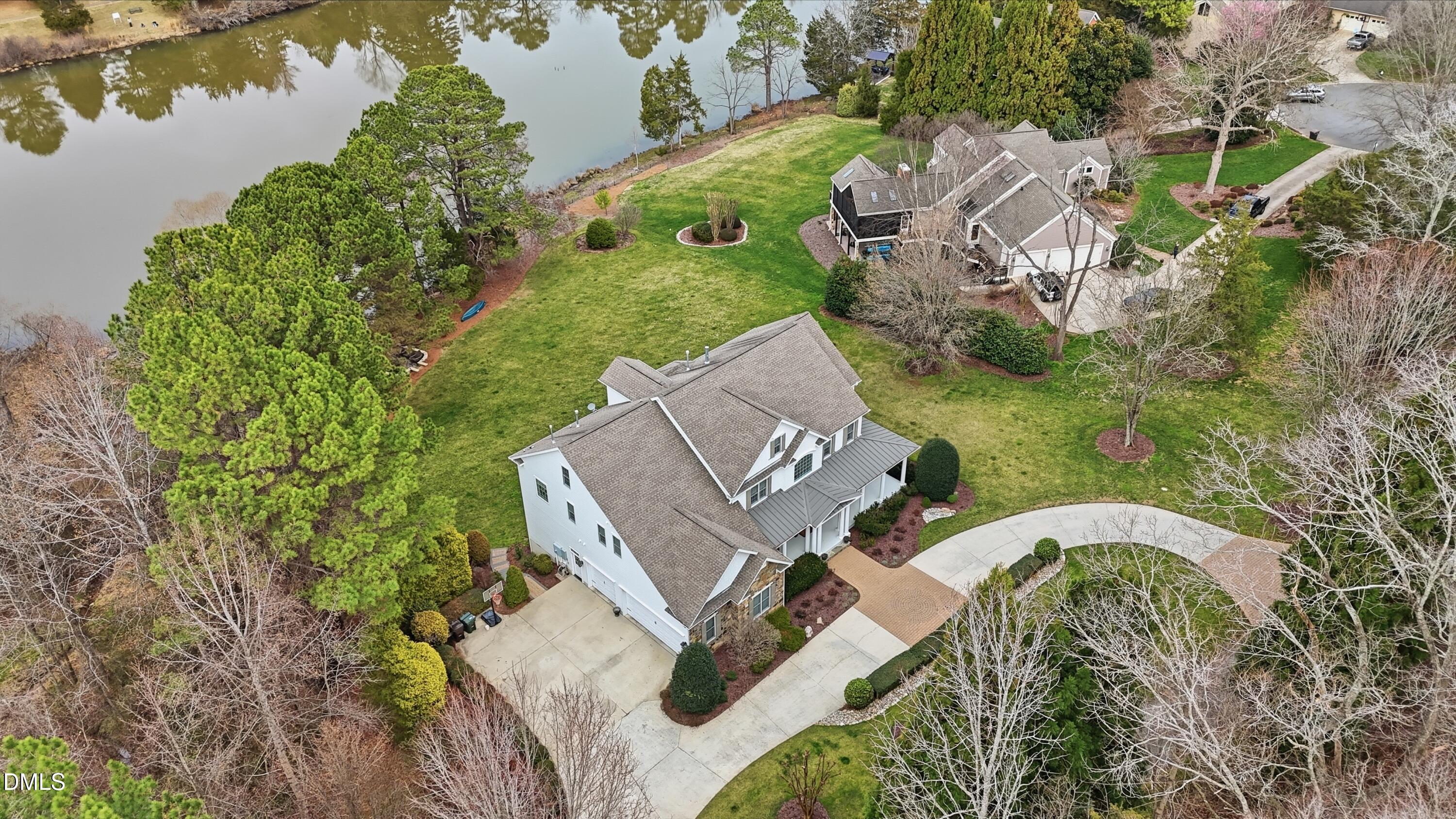 300 Lake Manor Road Chapel Hill, NC 27516 - Photo 75 of 99 an aerial view of a house with a garden and lake view