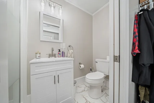 a bathroom with a sink toilet and vanity