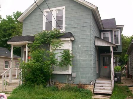 263 Raymond Street Elgin, IL 60120 - Photo 1 of 1 a front view of a house with garden