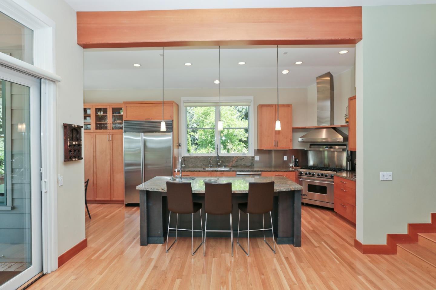203 Miramontes Road Woodside, CA 94062 - Photo 4 of 8 a view of a dining room with furniture window and wooden floor
