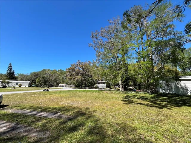 a view of a swimming pool with an outdoor space and seating area