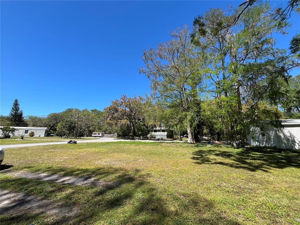 8546 Cameo Drive New Port Richey, FL 34654 - Photo 12 of 20 a view of a swimming pool with an outdoor space and seating area