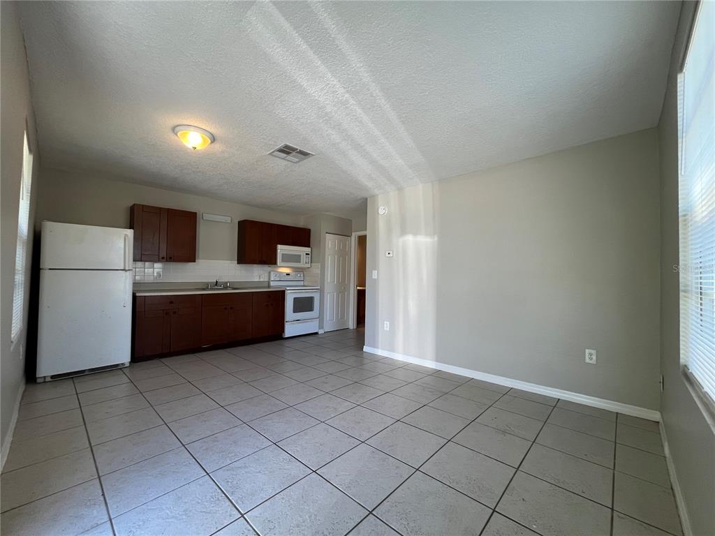 8546 Cameo Drive New Port Richey, FL 34654 - Photo 14 of 20 a view of a kitchen with microwave and cabinets