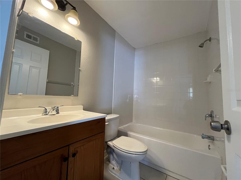 8546 Cameo Drive New Port Richey, FL 34654 - Photo 18 of 20 a bathroom with a sink a toilet and shower