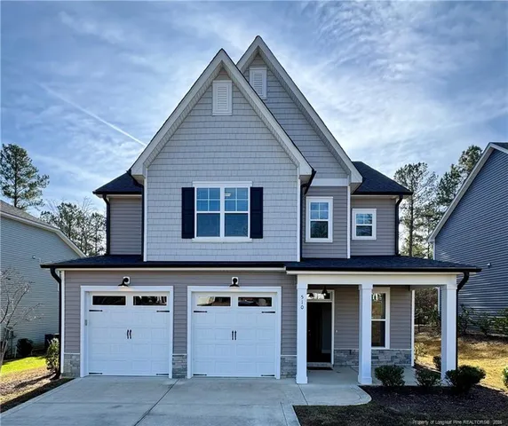 a view of a house with garage