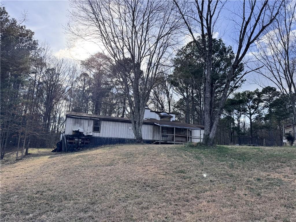 80 Pine Needle Trail Southeast Cartersville, GA 30121 - Photo 7 of 10 a view of a house with a yard and trees