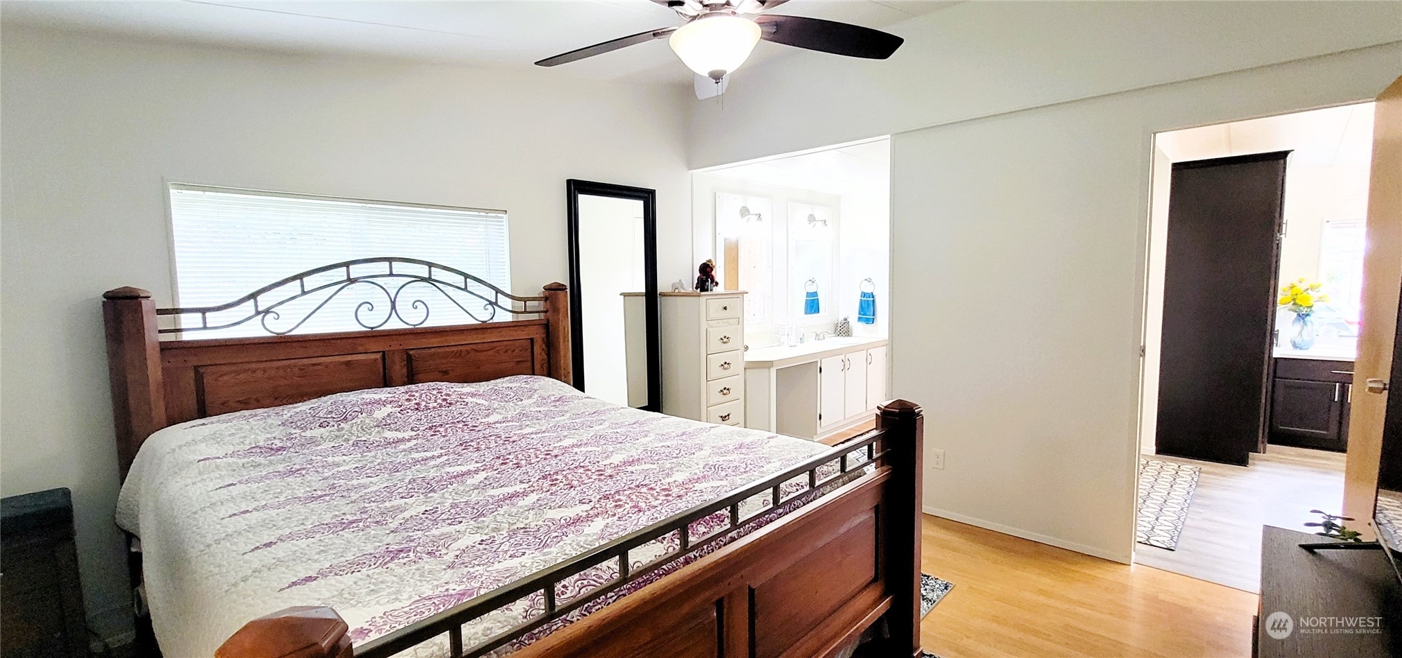 344 Atterberry Road Sequim, WA 98382 - Photo 17 of 40 a bedroom with a bed and a chandelier