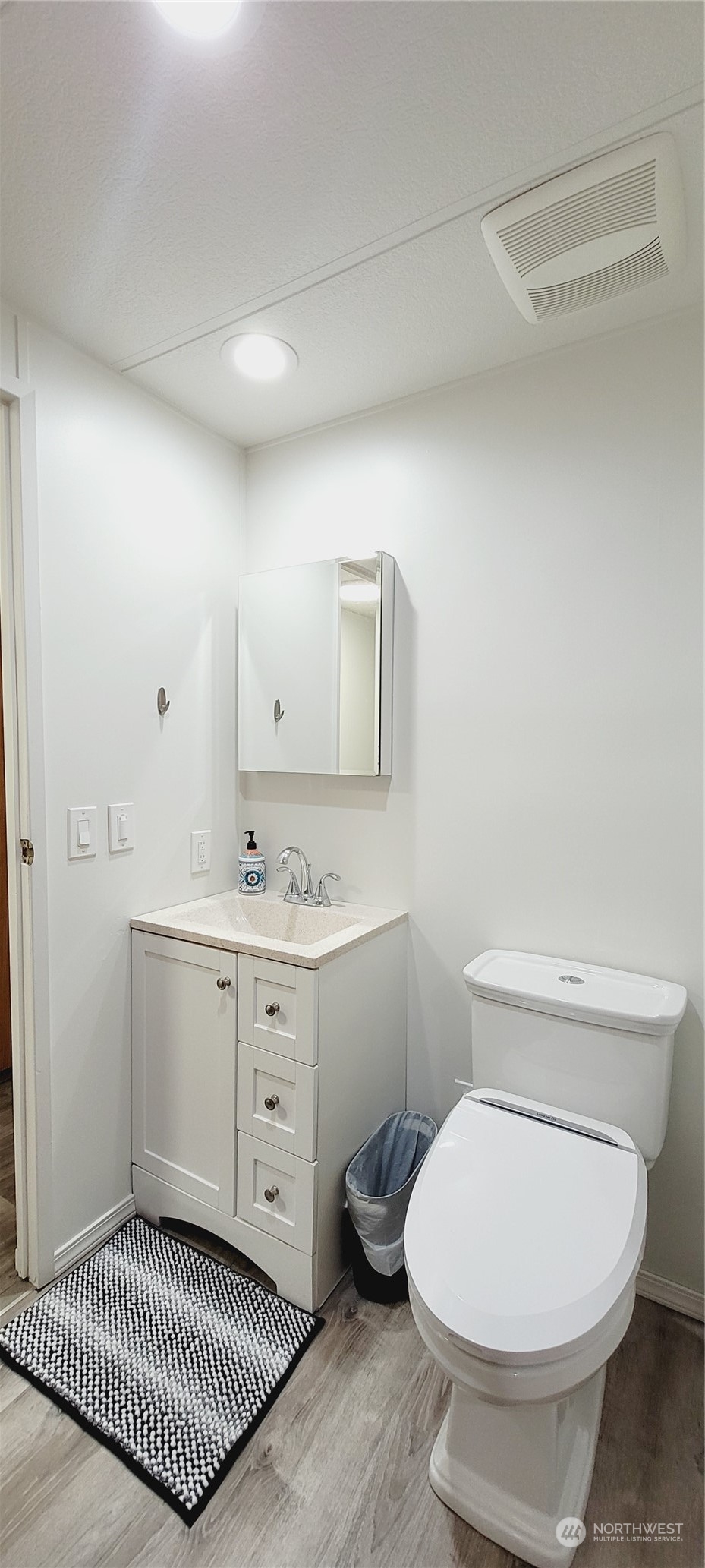 344 Atterberry Road Sequim, WA 98382 - Photo 24 of 40 a bathroom with a toilet sink and mirror