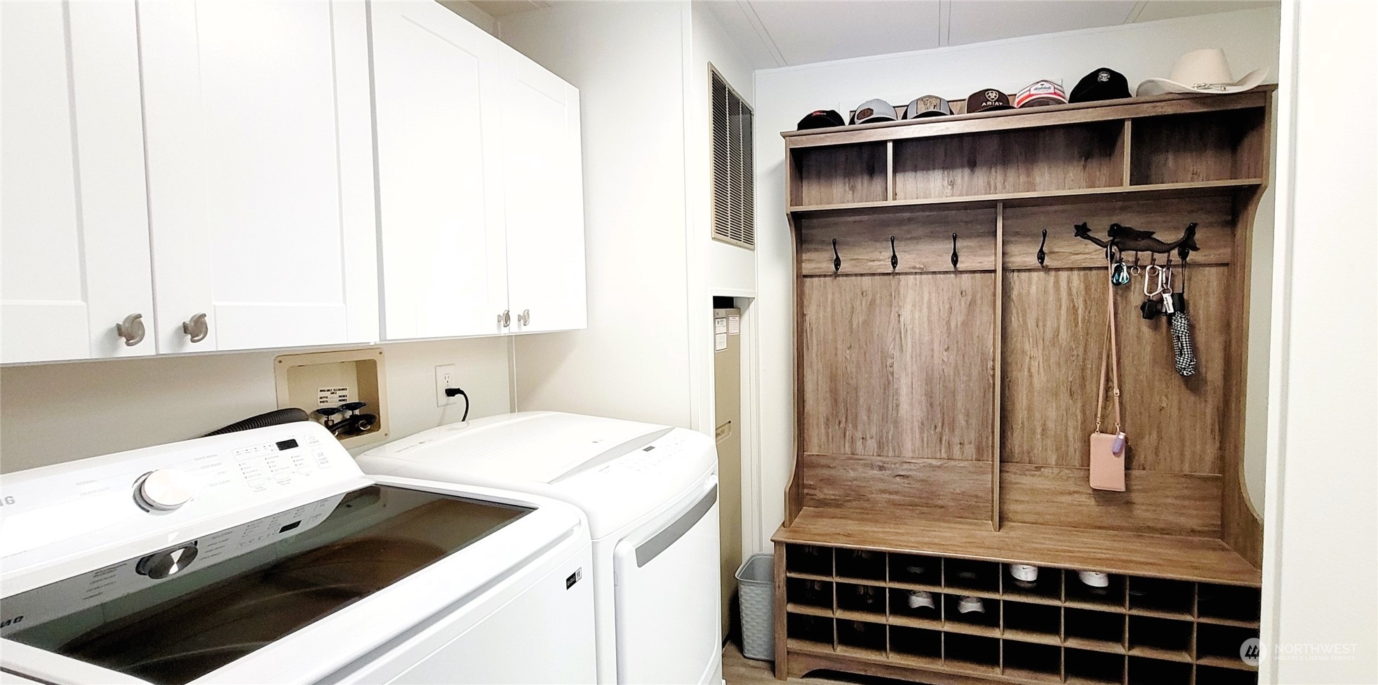 344 Atterberry Road Sequim, WA 98382 - Photo 25 of 40 a room with a washing machine and cabinets