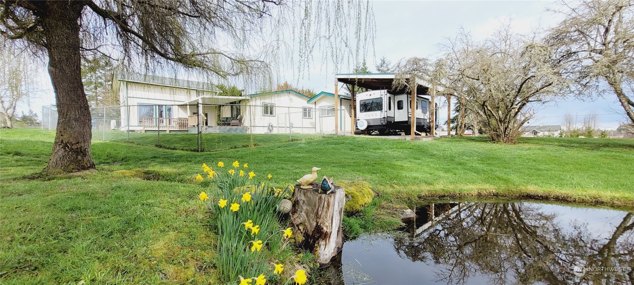 344 Atterberry Road Sequim, WA 98382 - Photo 34 of 40 a view of a garden with a fountain