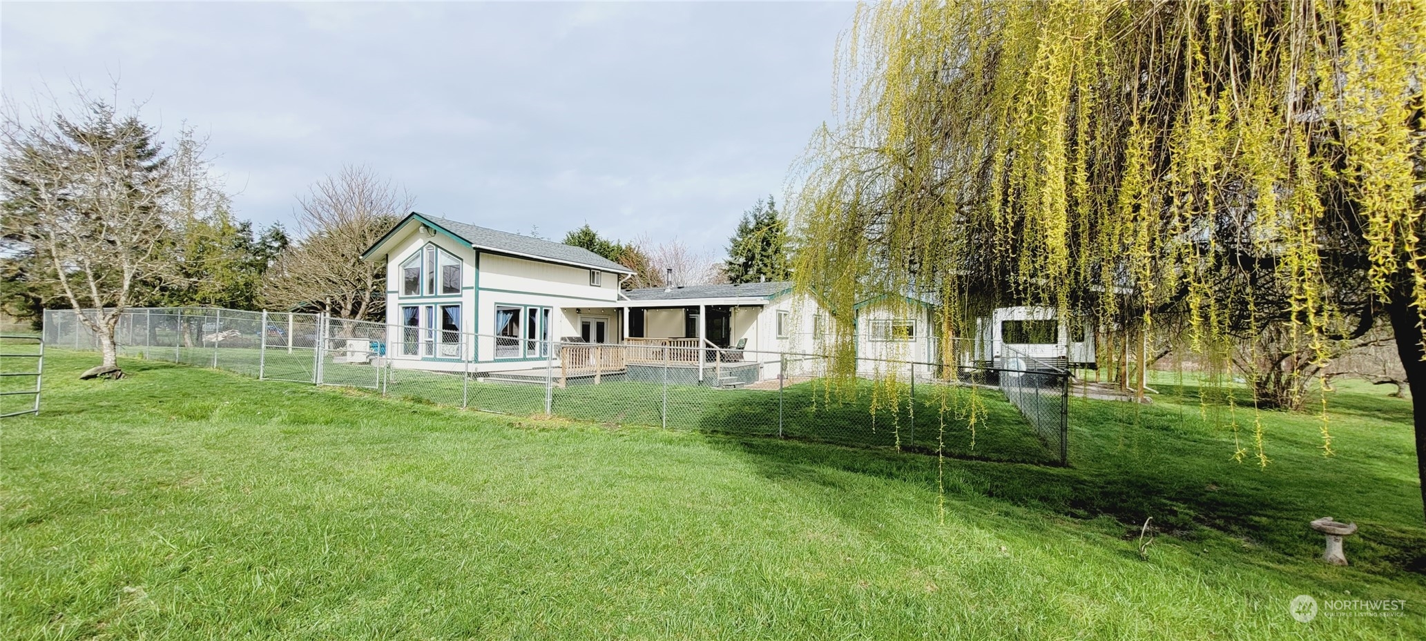 344 Atterberry Road Sequim, WA 98382 - Photo 35 of 40 a view of a house with a big yard and large trees