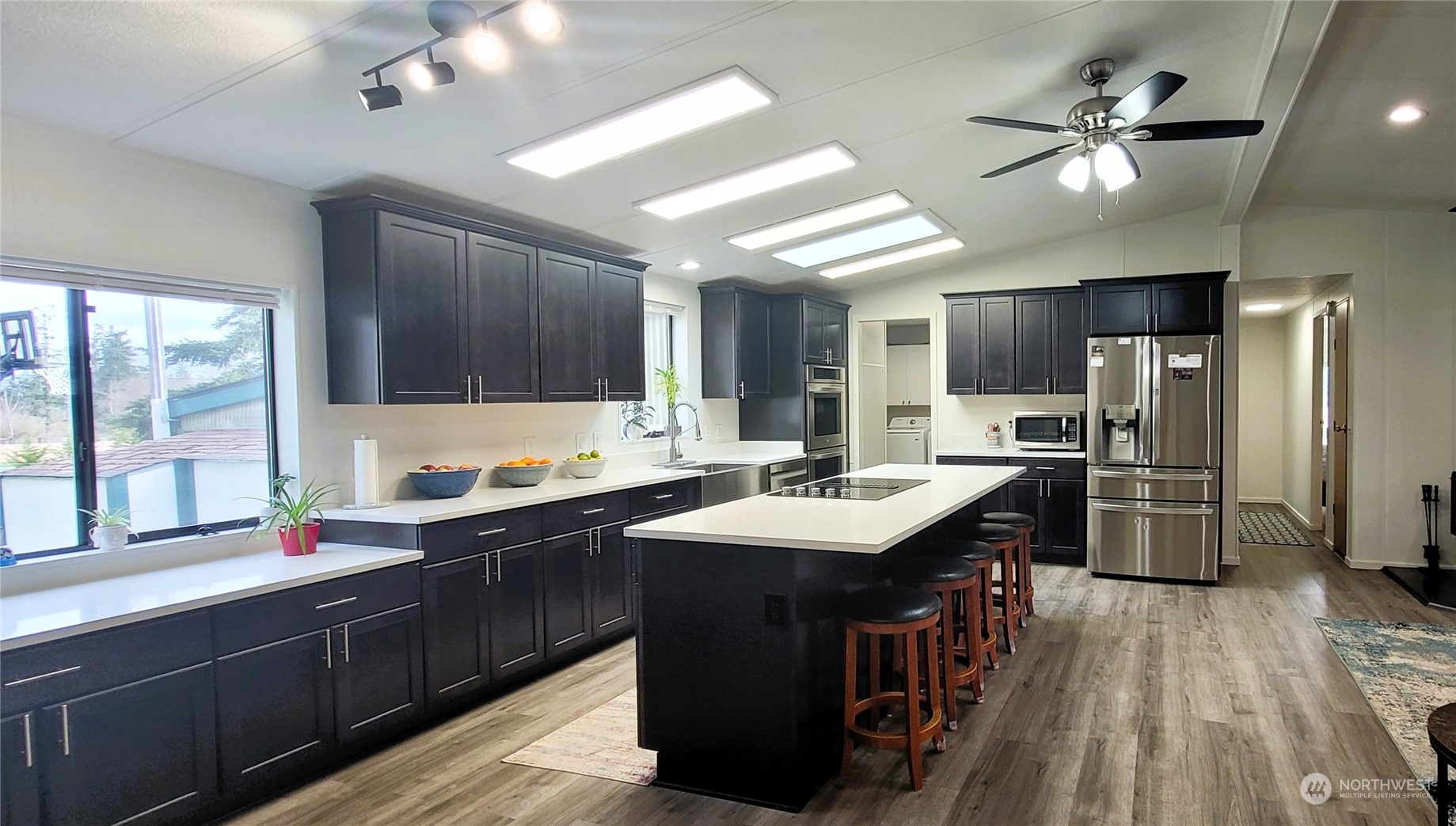 344 Atterberry Road Sequim, WA 98382 - Photo 4 of 40 a kitchen with a sink appliances and cabinets
