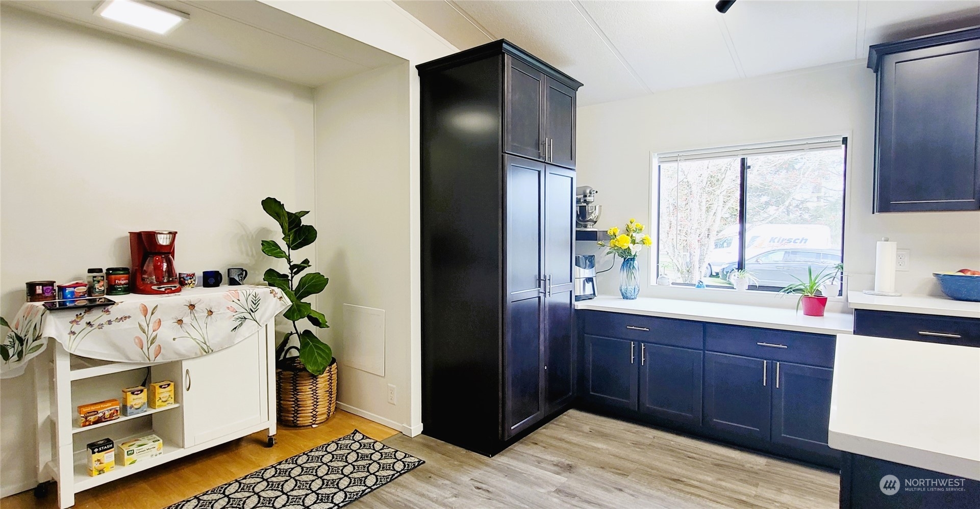 344 Atterberry Road Sequim, WA 98382 - Photo 5 of 40 a kitchen with a sink stainless steel appliances and wooden cabinets