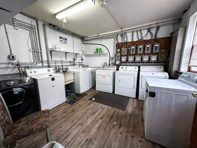 a kitchen with sink a stove and cabinets
