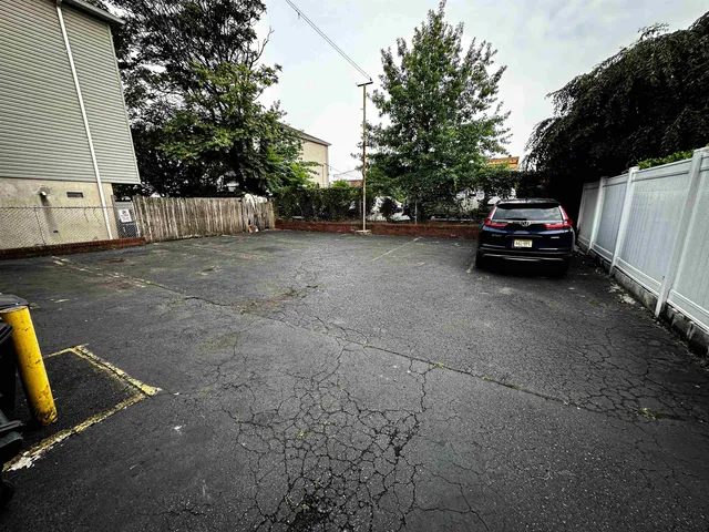 a view of a car parked on the side of the road