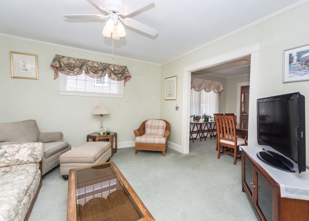 279-281 Ash Street Waltham, MA 02453 - Photo 13 of 39 a living room with furniture and a flat screen tv