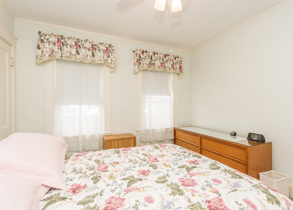 279-281 Ash Street Waltham, MA 02453 - Photo 17 of 39 a bedroom with a bed and a dresser in it