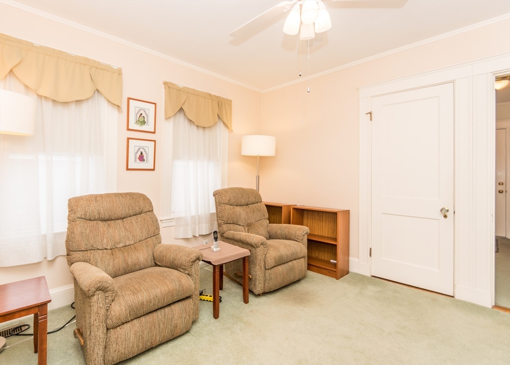279-281 Ash Street Waltham, MA 02453 - Photo 18 of 39 a living room with furniture and a window