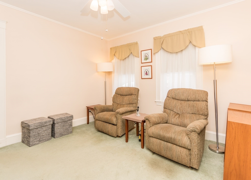 279-281 Ash Street Waltham, MA 02453 - Photo 19 of 39 a living room with furniture and a couch