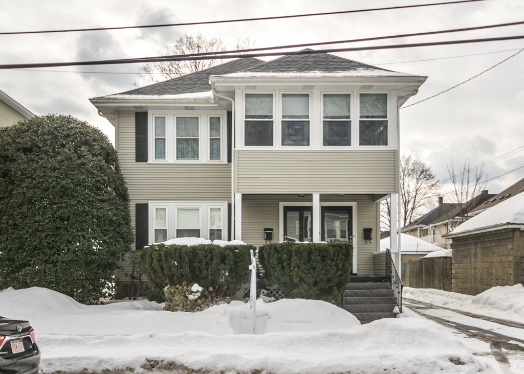 279-281 Ash Street Waltham, MA 02453 - Photo 2 of 39 a view of a white house with iron fence