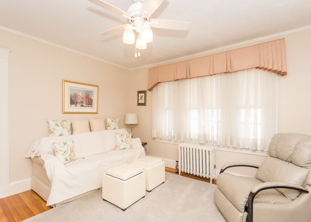 279-281 Ash Street Waltham, MA 02453 - Photo 31 of 39 a living room with furniture and a large window