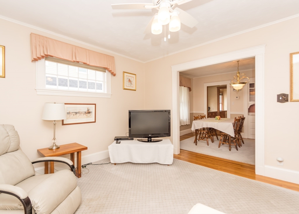 279-281 Ash Street Waltham, MA 02453 - Photo 32 of 39 a living room with furniture and a flat screen tv