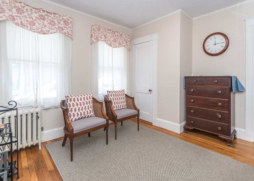 279-281 Ash Street Waltham, MA 02453 - Photo 35 of 39 a living room with furniture and a window