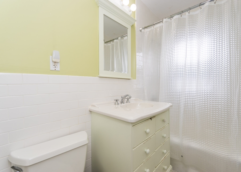 279-281 Ash Street Waltham, MA 02453 - Photo 37 of 39 a bathroom with a sink a toilet and shower