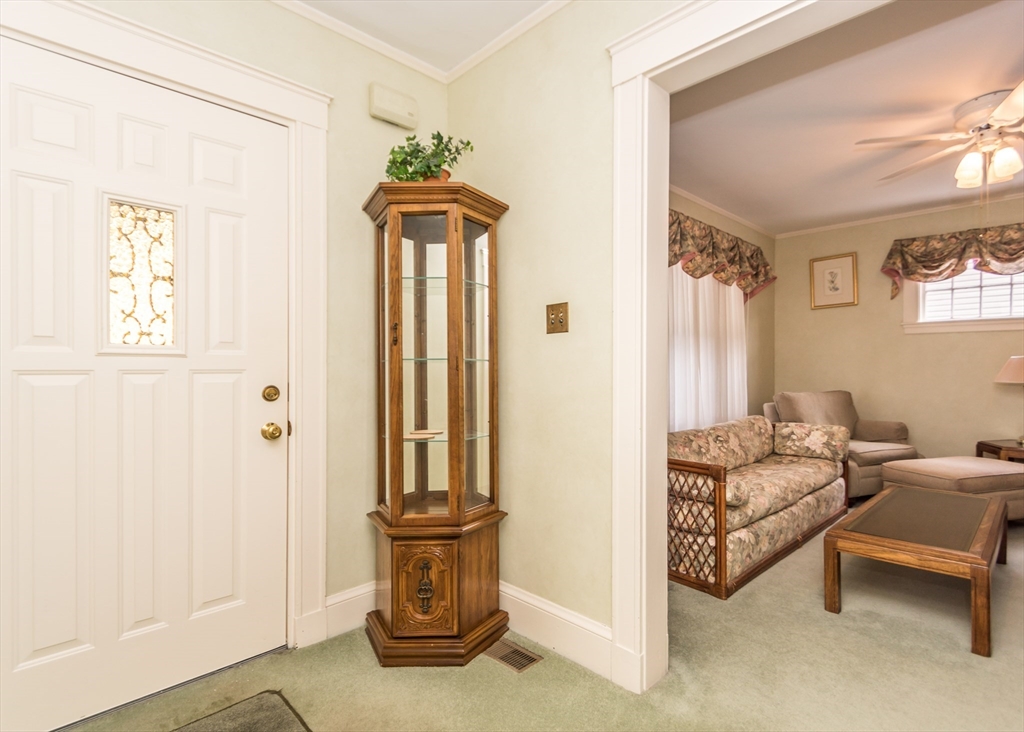 279-281 Ash Street Waltham, MA 02453 - Photo 4 of 39 a living room with furniture and a window