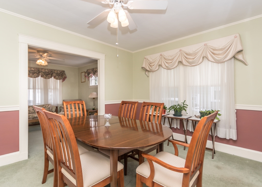 279-281 Ash Street Waltham, MA 02453 - Photo 10 of 39 a view of a dining room with furniture window and outside view