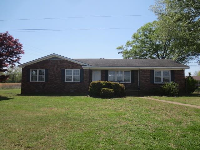 2930 Lovelace Crossing Road Henning, TN 38041 - Photo 1 of 16 Single story home featuring brick siding and a front lawn