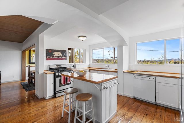 a kitchen with a refrigerator and a sink